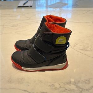 Sorel Orange Boots with Rugged Design and Slip-On Style